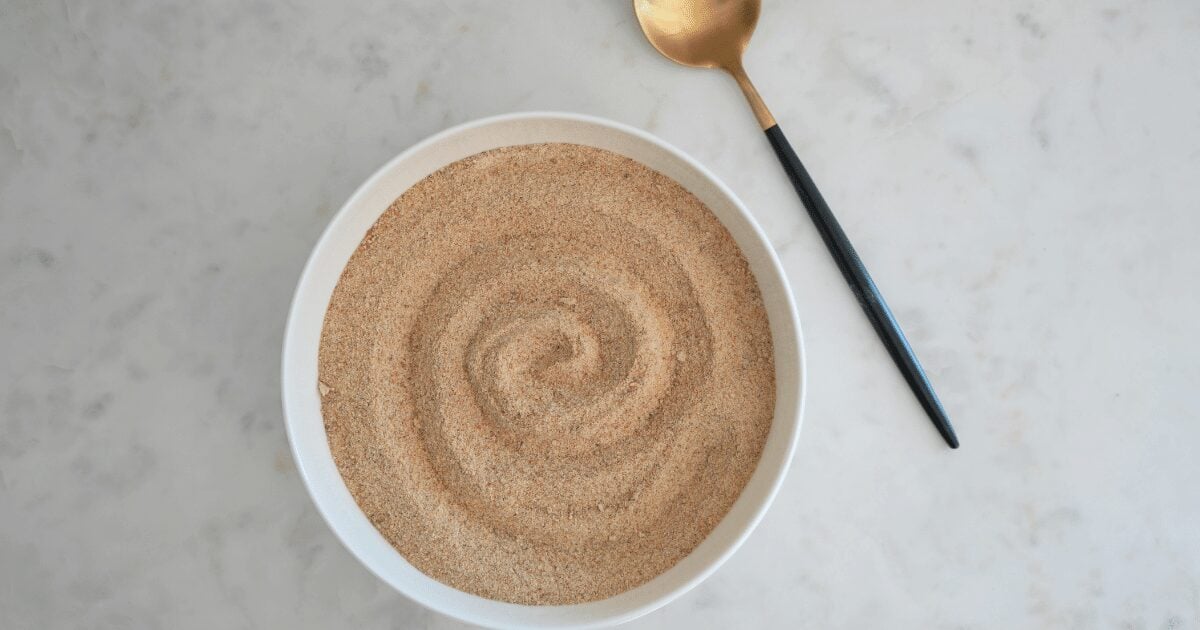Sourdough breadcrumbs shown with gold, decorative spoon