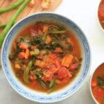 Overhead view of bowls filled with fire-roasted tomato veggie soup