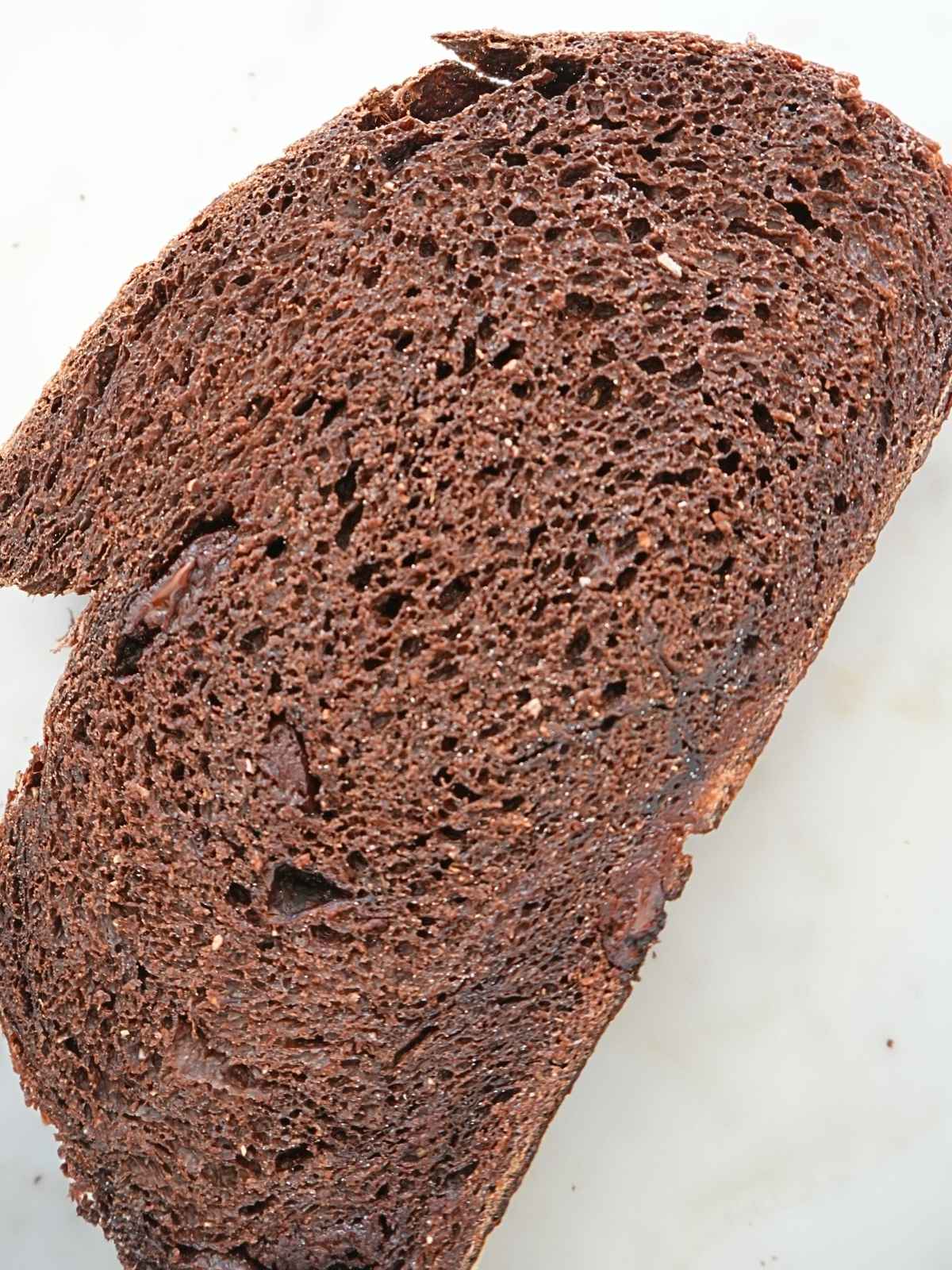 A slice of chocolate sourdough bread.