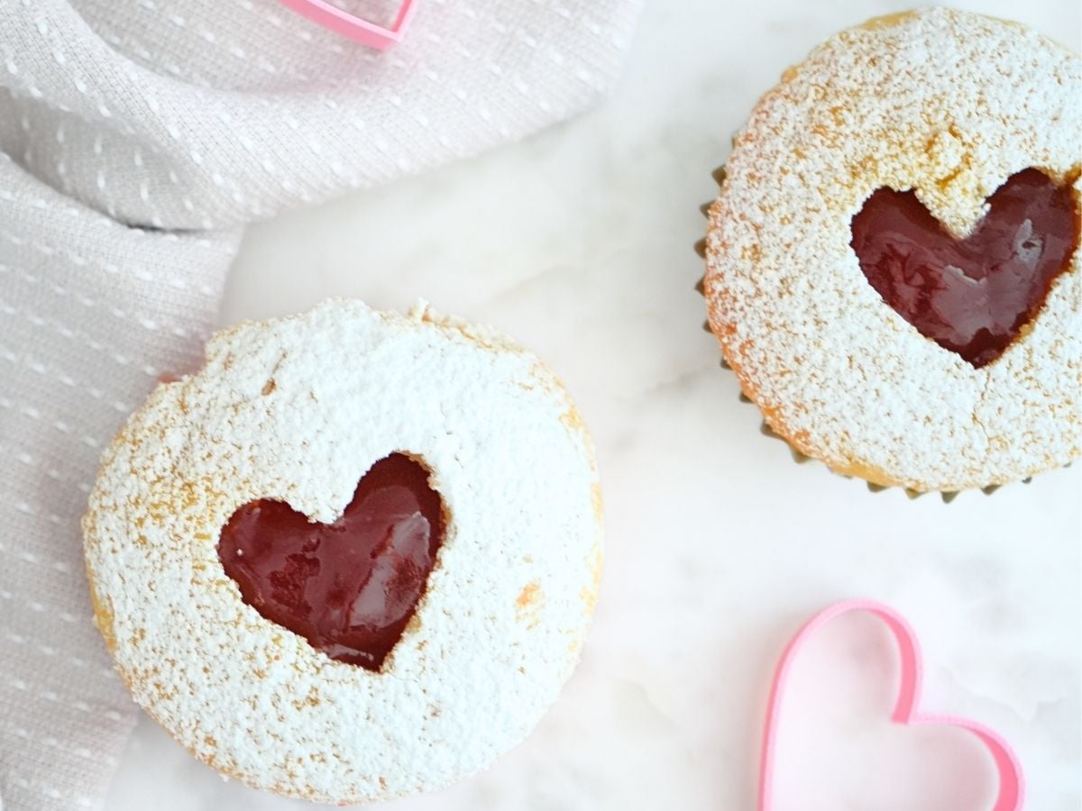 Valentine's Day heart cupcakes filled displayed heart cookie cutters.