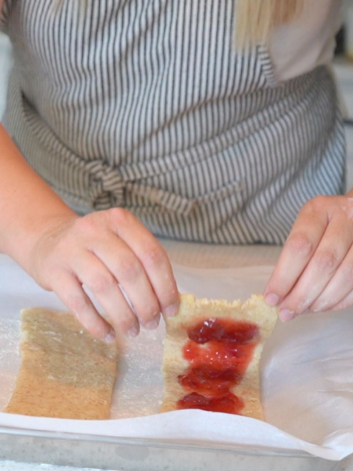 Hands folding over a sourdough Pop Tart.