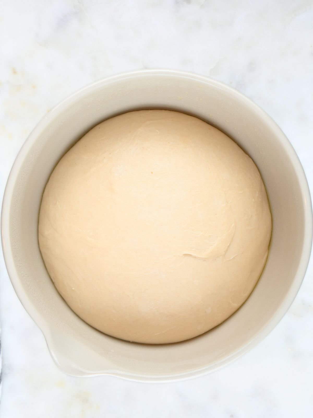 Sourdough dough in a bowl that has doubled in size.