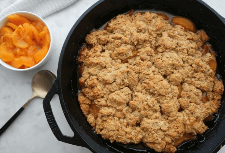 Sourdough peach cobbler in cast iron skillet