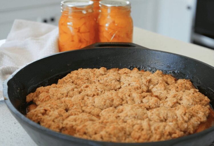 Sourdough peach cobbler with home-canned peaches in the background