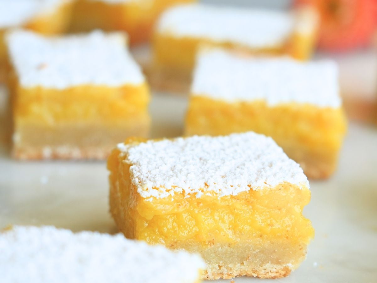 Sourdough lemon bars scattered on a counter.