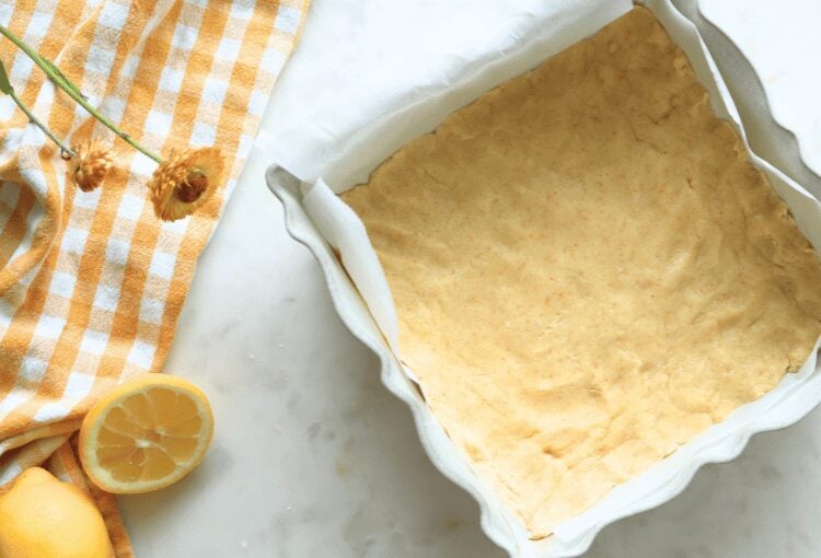 Shortbread crust dough in baking dish