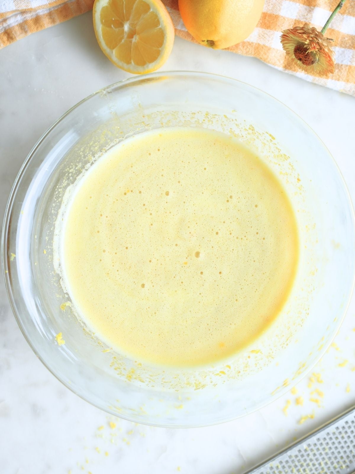 Sourdough lemon bar filling in a mixing bowl.