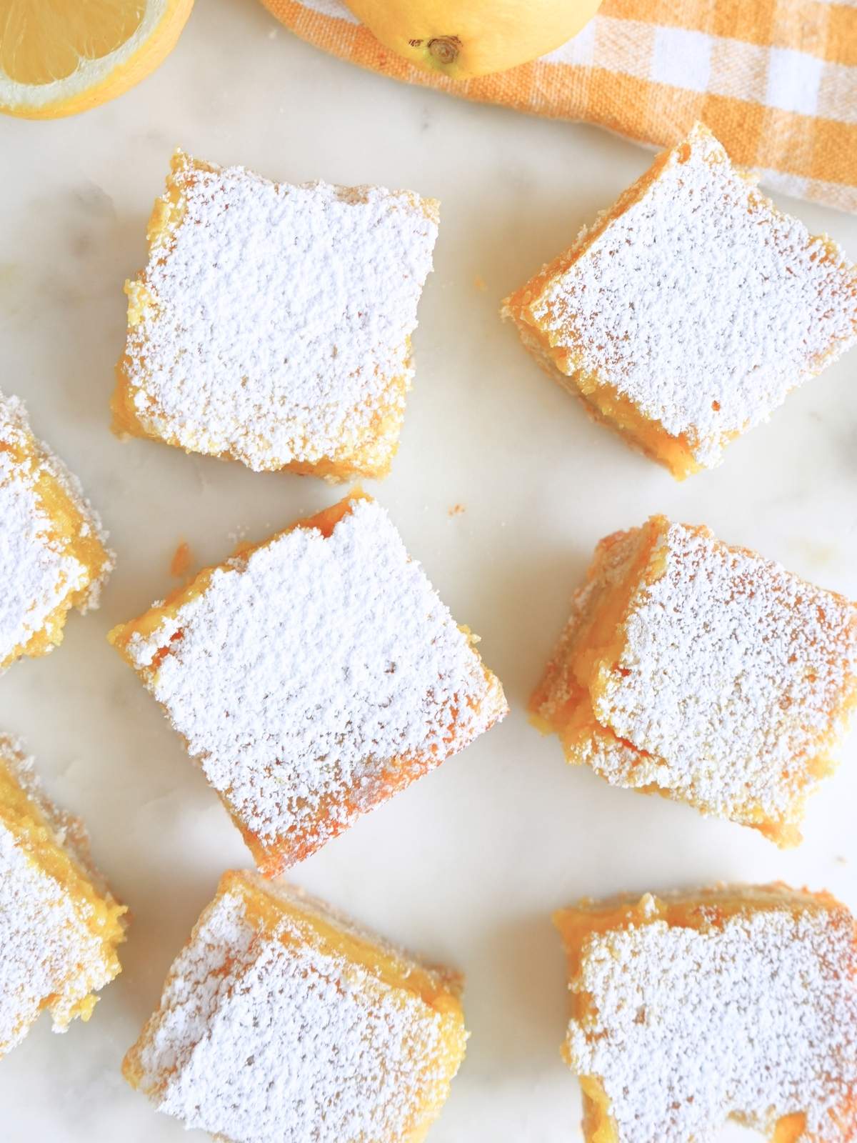 Cut sourdough lemon bars, dusted with powdered sugar.