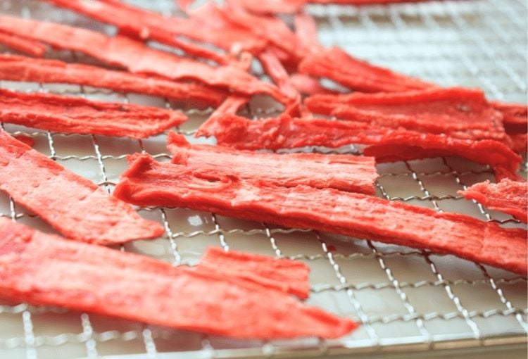 Watermelon jerky on a dehydrator tray