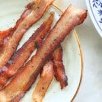 Close up of homemade bacon on a decorative plate