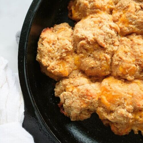 Einkorn cheddar drop biscuits in a cast iron skillet