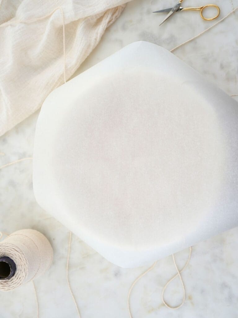 Parchment paper covering the dough.
