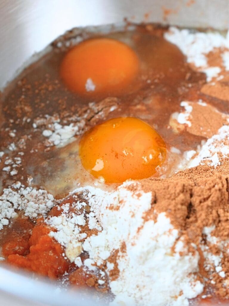 Dough ingredients in a stand mixer bowl.