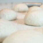 Freezer-friendly sourdough pizza dough balls on counter