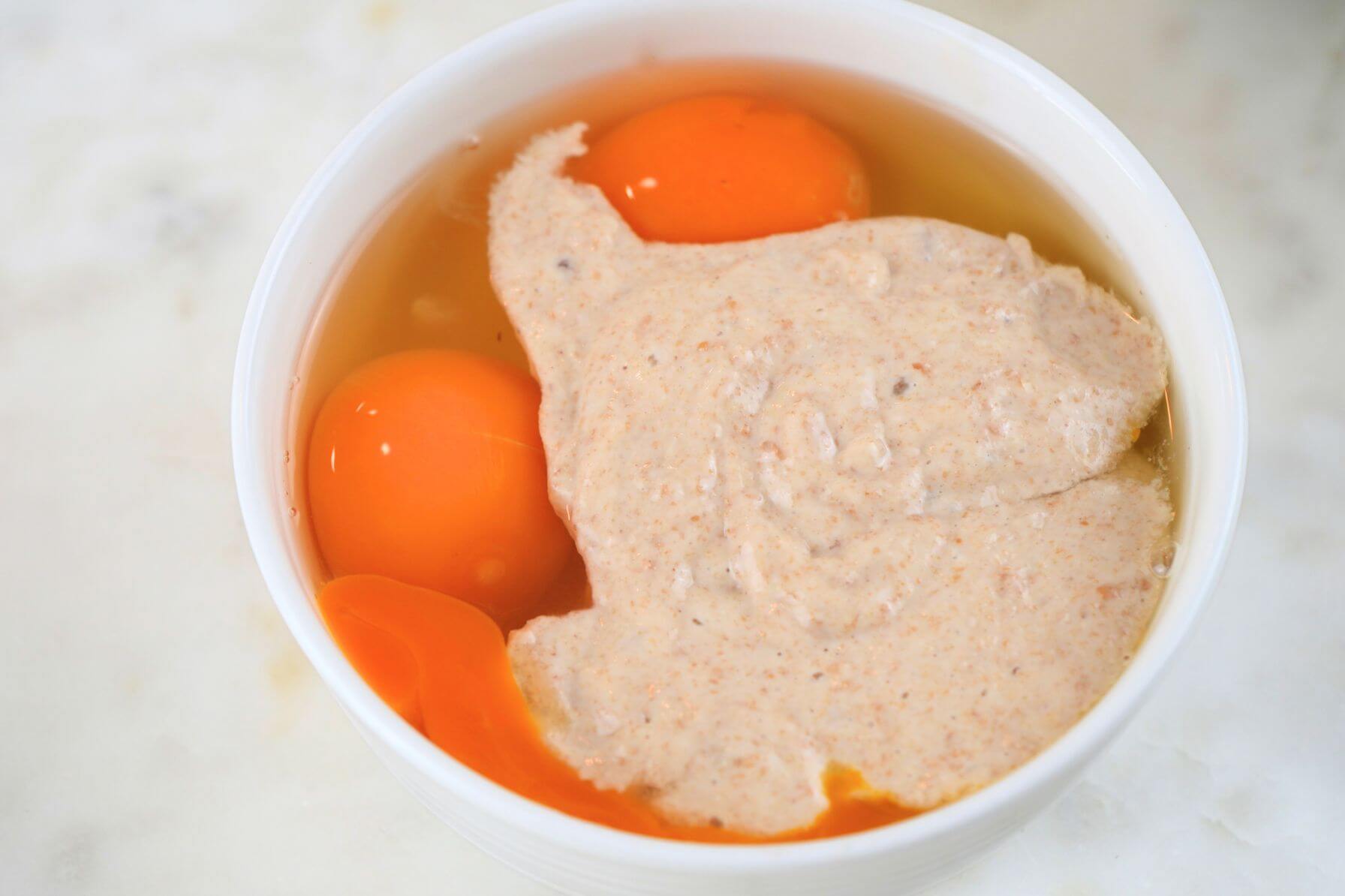 A bowl filled with eggs and sourdough discard.