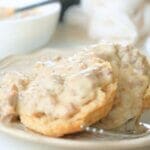 Sourdough biscuits and gravy on a plate with fork