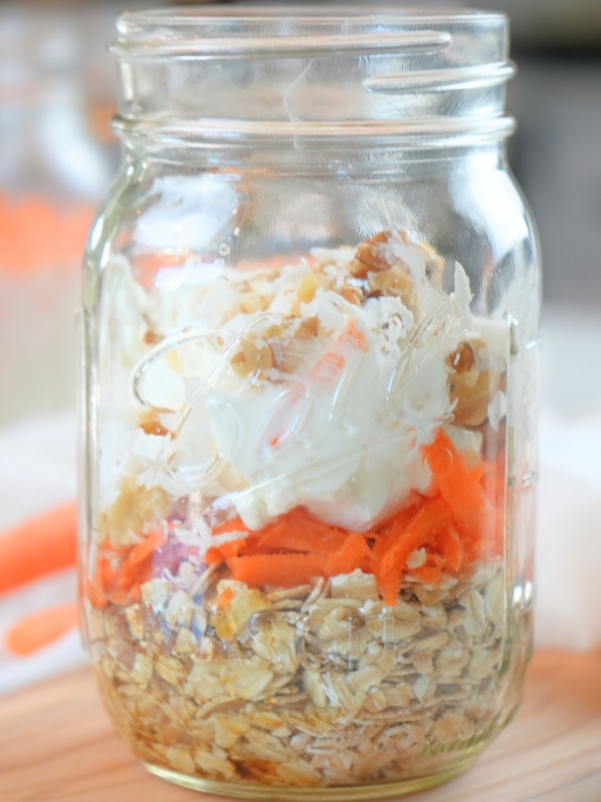 Oat mixture and yogurt in a mason jar.