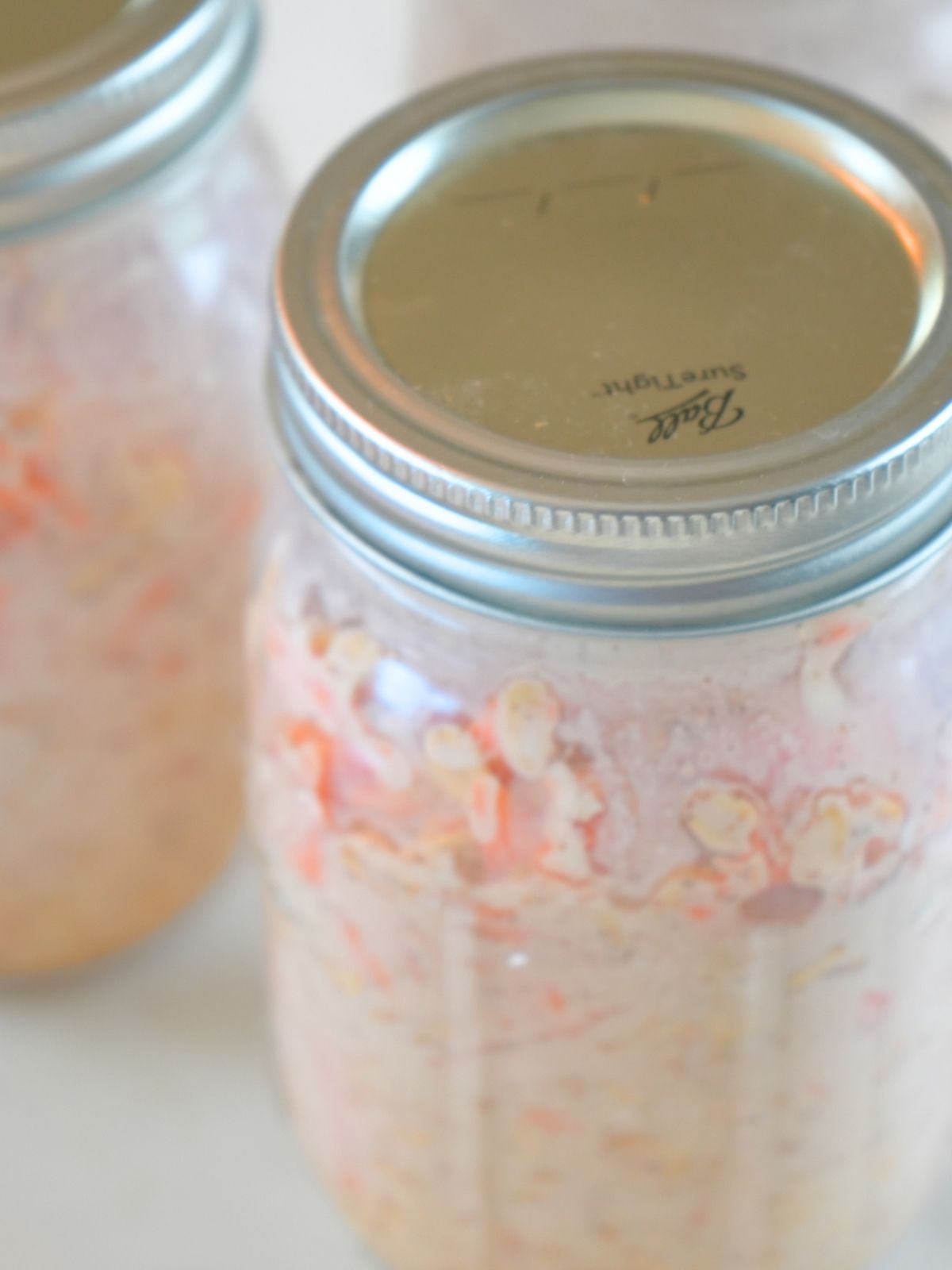 Filled mason jar closed with a metal lid and ring.