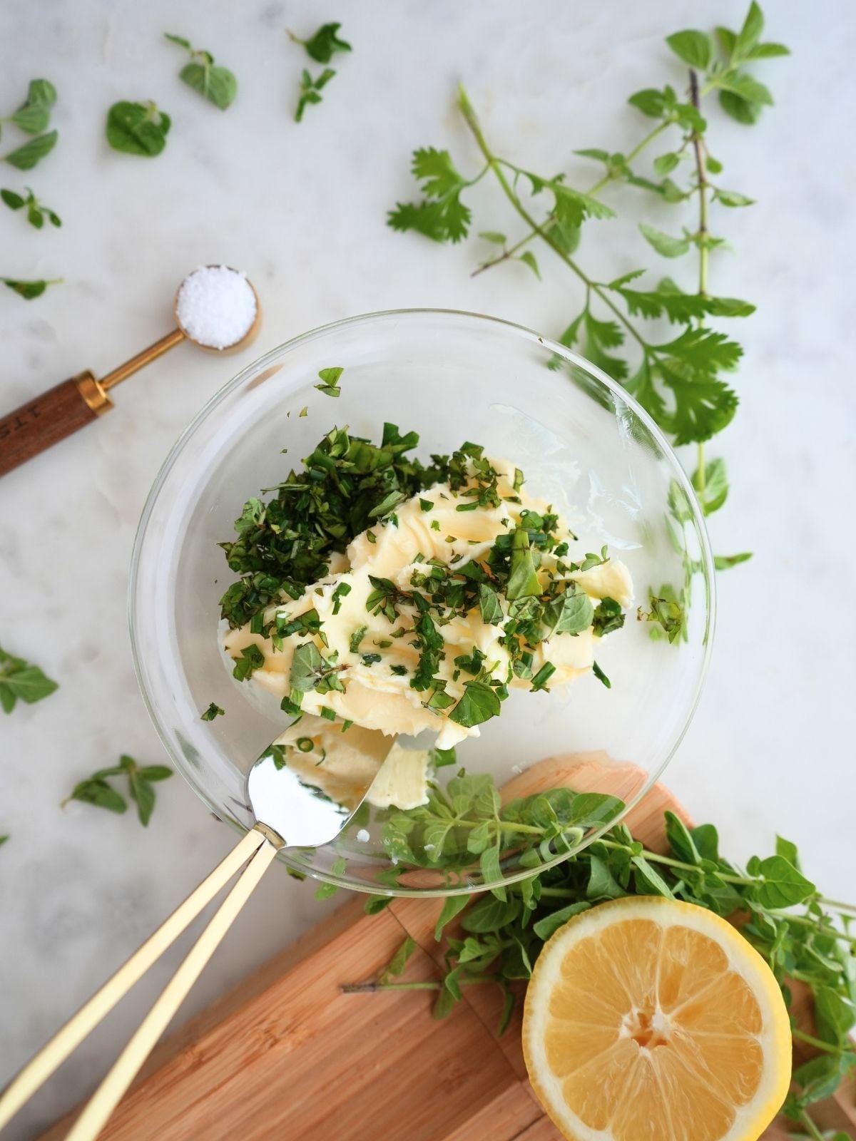 Butter and fresh herbs in a bowl.