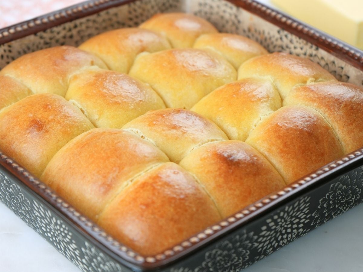Sourdough brioche rolls in a baking dish.