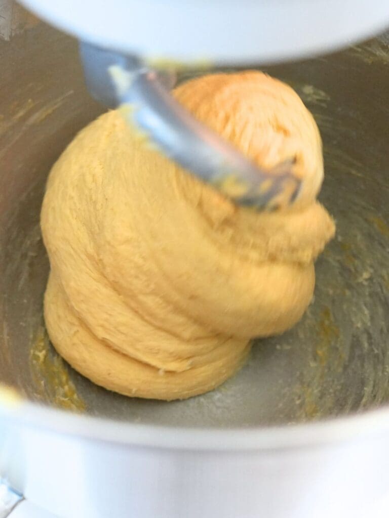 Dough in a stand mixer with a dough hook attachment
