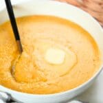 Southern cheese grits with a pat of butter in a bowl