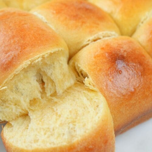 Pull-apart sourdough rolls, with a corner roll pulled off