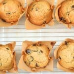 Fresh-milled sourdough chocolate chips muffins on a wire cooling rack