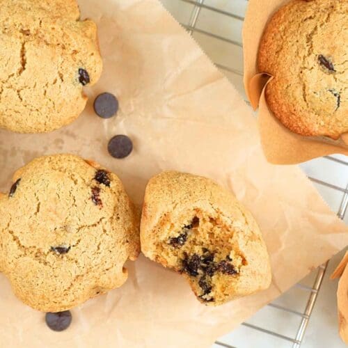 Muffins scattered on a parchment paper and a cooking rack