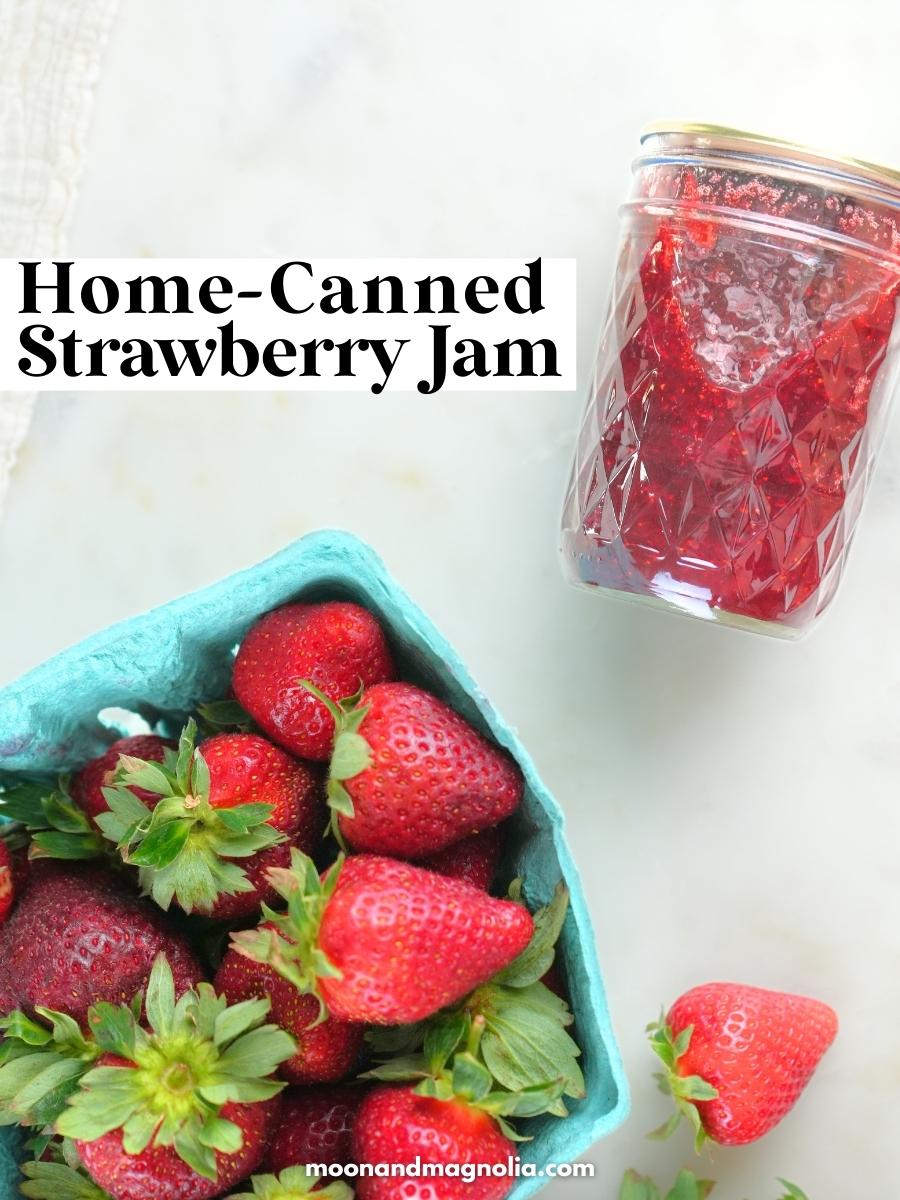 A berry box filled with strawberries and a jar of jam with text overlay "Home-Canned Strawberry Jam"