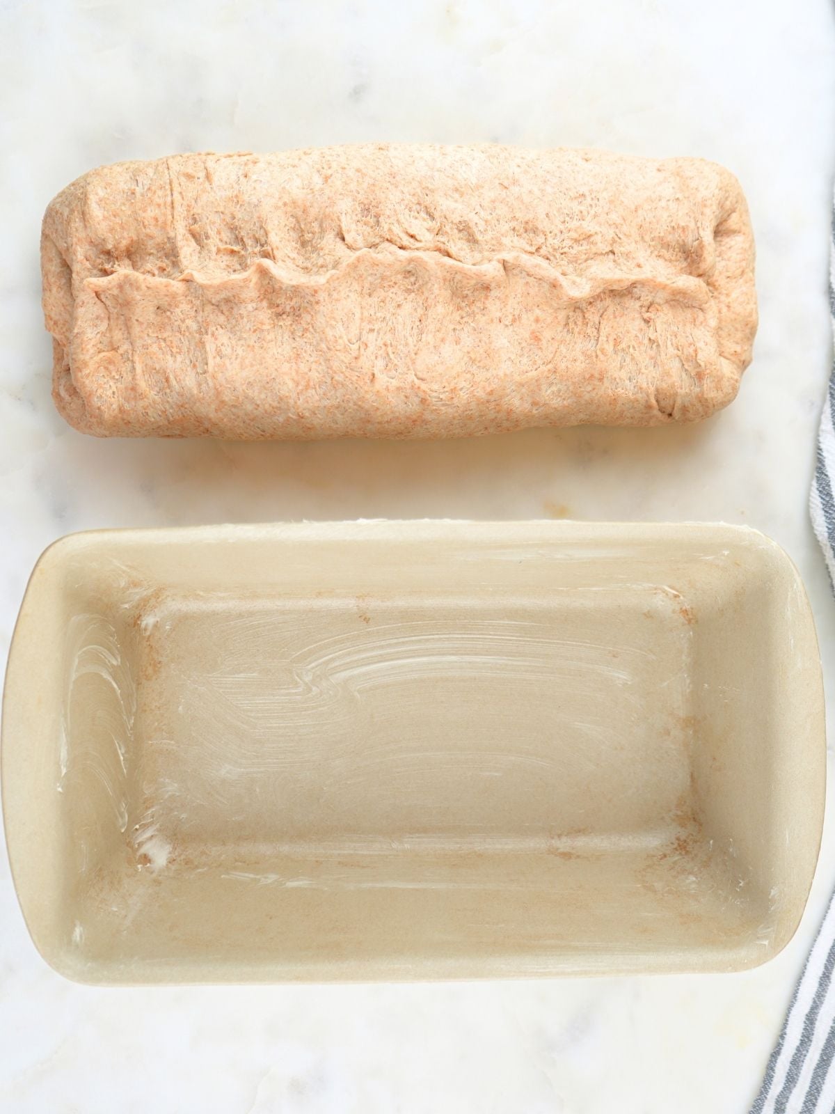 Dough with the long edges folded to the center and pinched together.