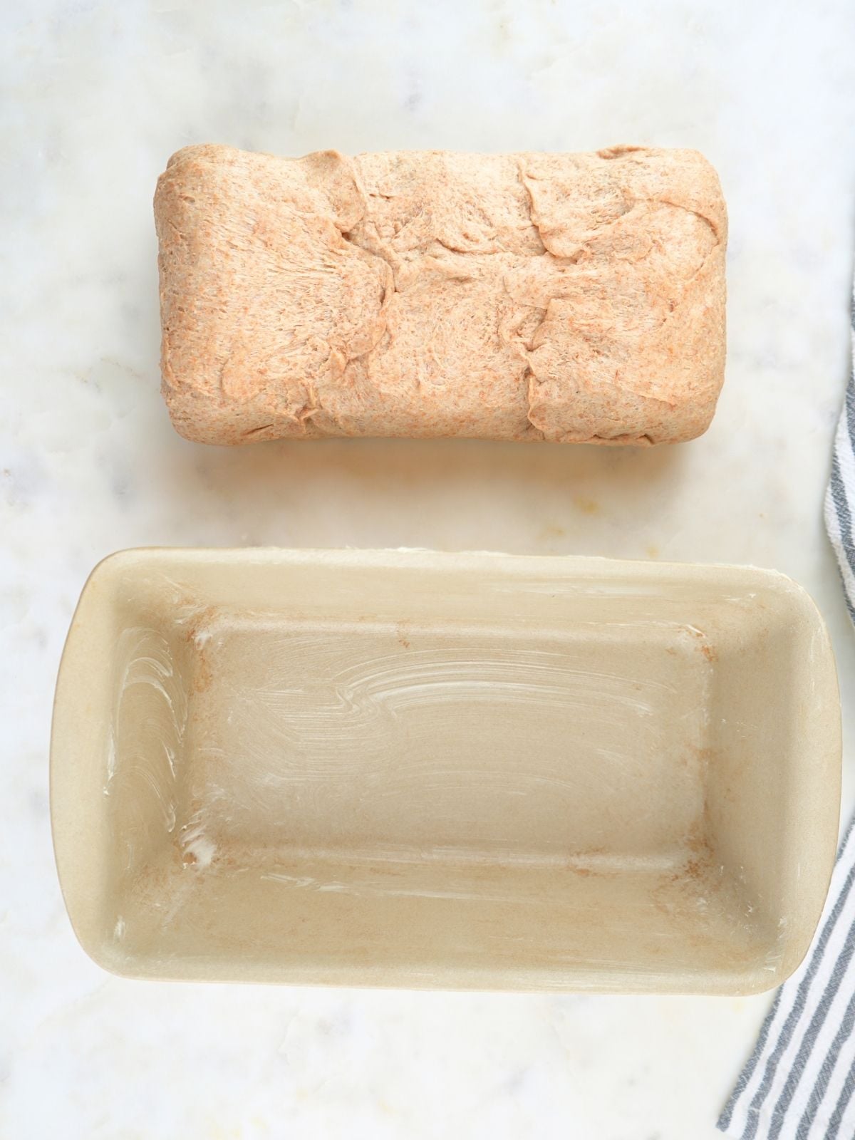 Sourdough sandwich bread dough with the short edges folded and pinched together.