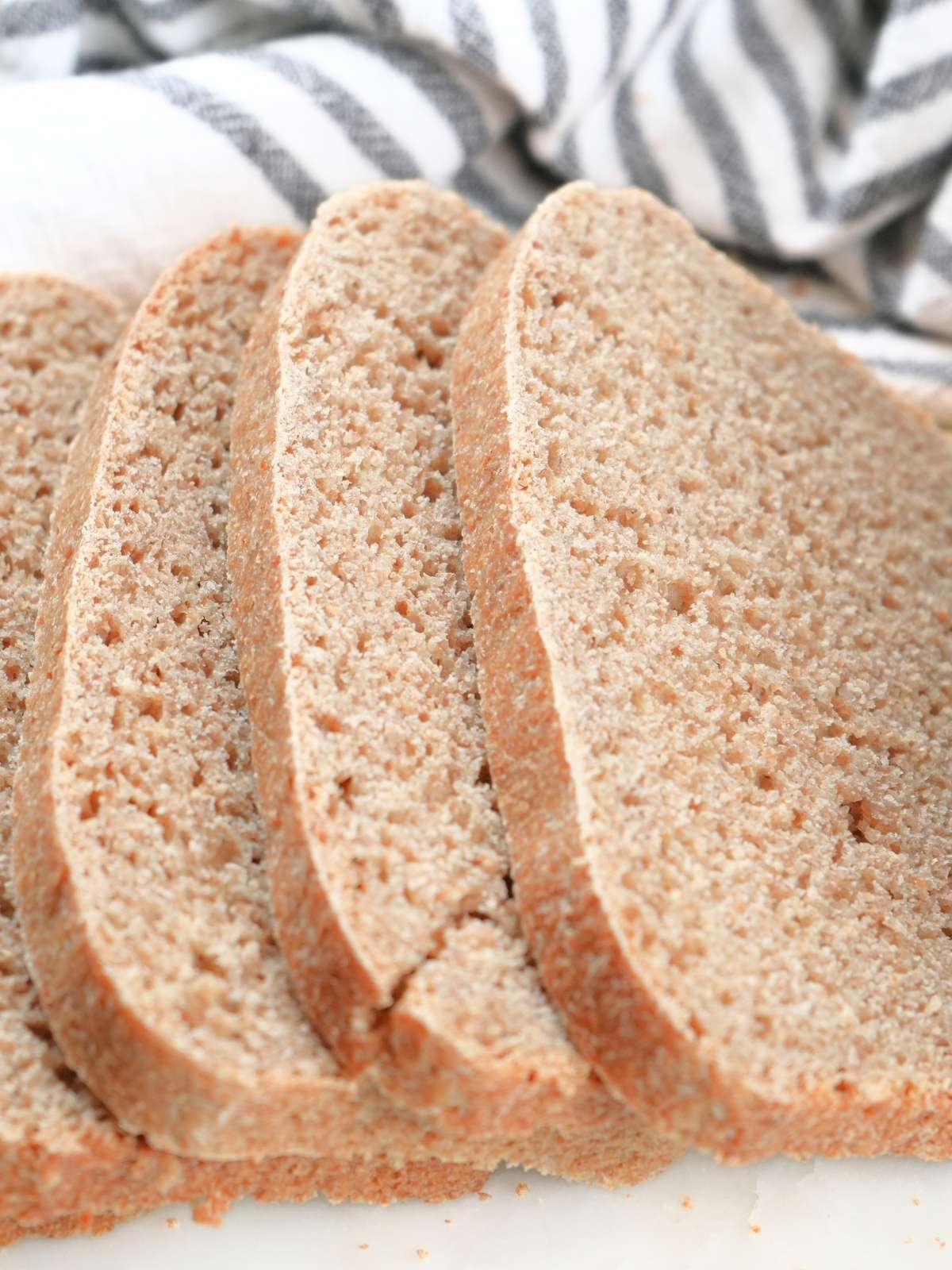 Slices of fresh-milled sourdough sandwich bread, showing the crumb.