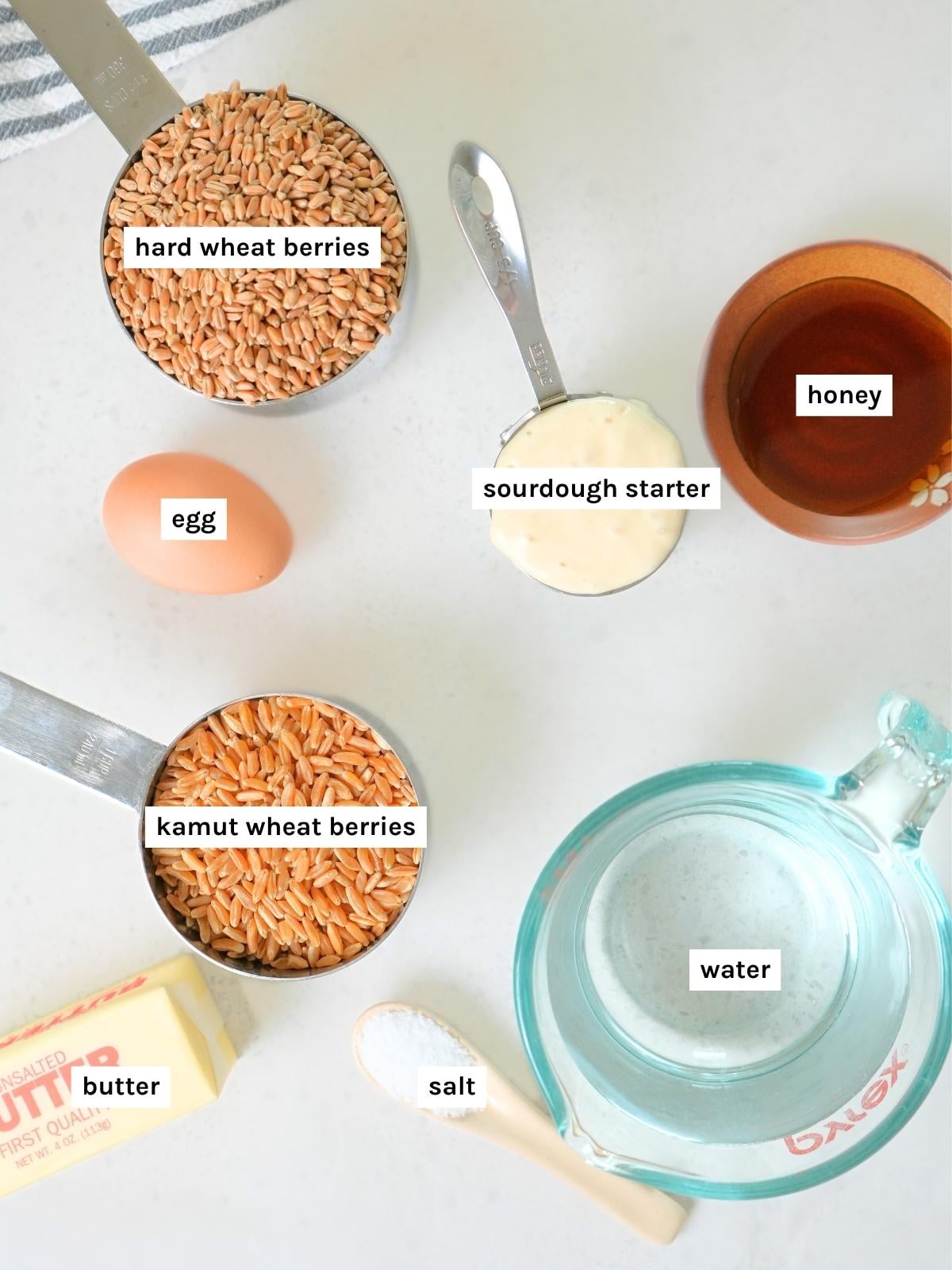 Fresh-milled sourdough sandwich bread ingredients displayed and labeled.
