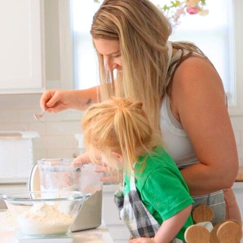 A mom and daughter making sourdough bread together