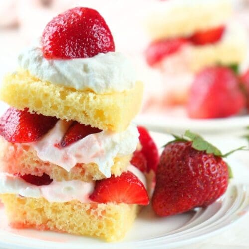 Sourdough strawberry shortcake on a plate with fresh berries.