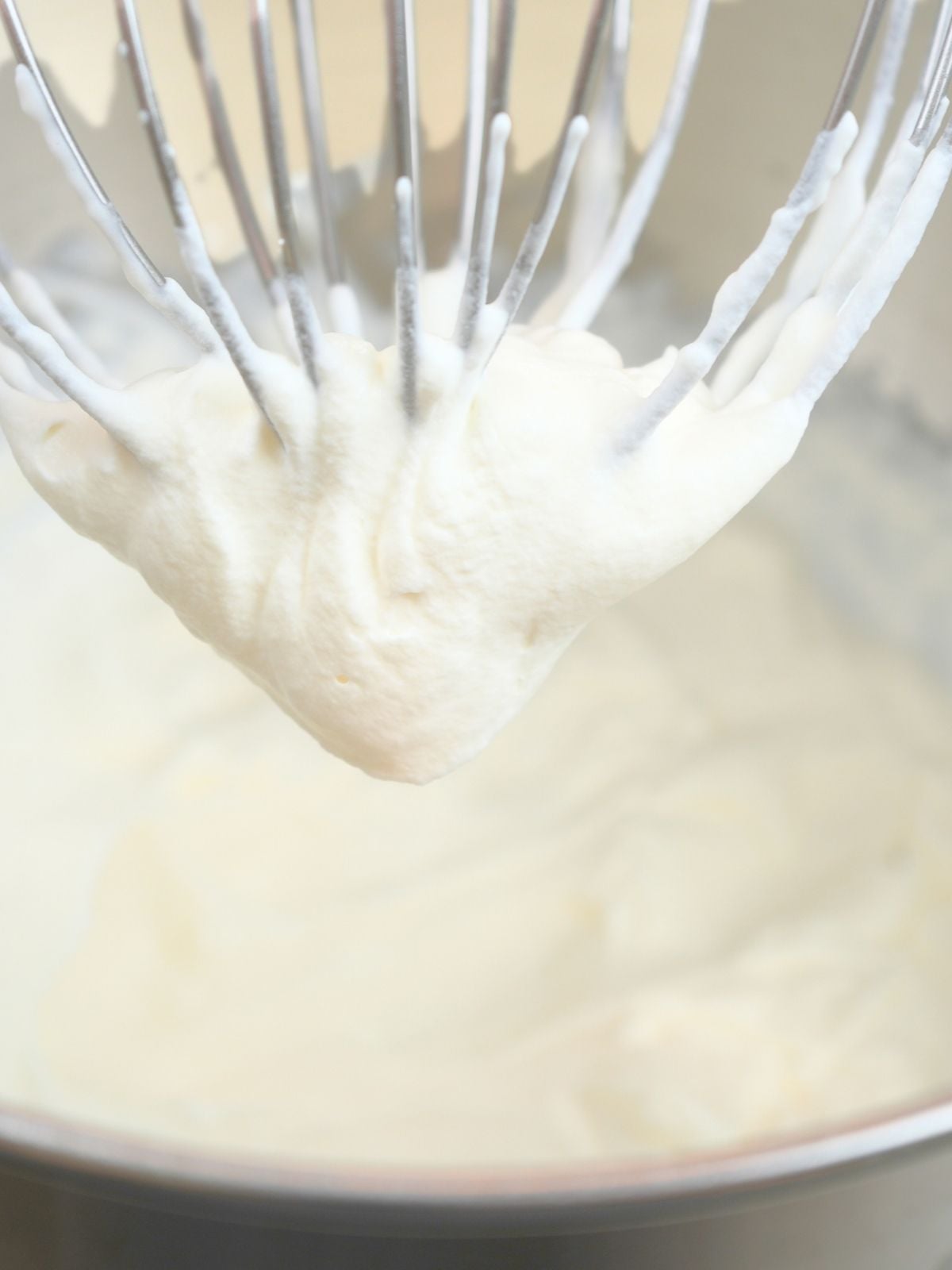 Whipped cream on a wire whisk.
