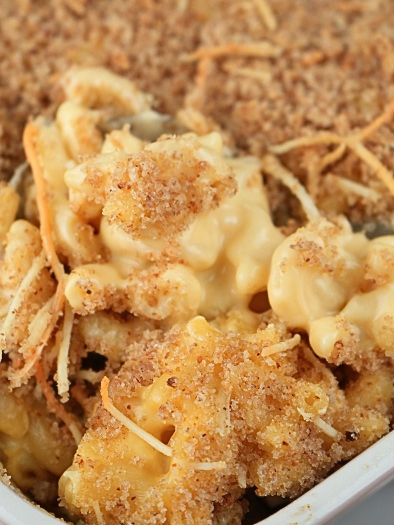 A close up of sourdough mac and cheese, showing the breadcrumbs and cheese sauce
