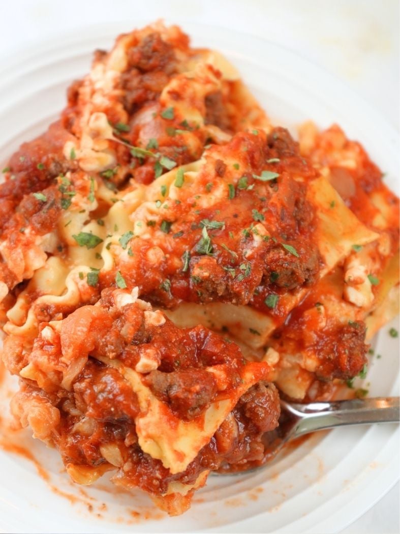 A close up of a slice of slow cooker lasagna