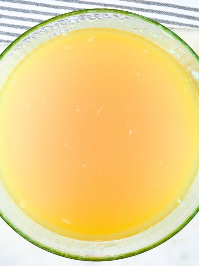 Chicken broth in a glass bowl