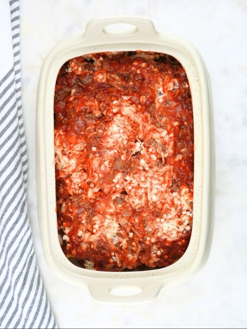 Slow cooker lasagna assembled and ready to cook