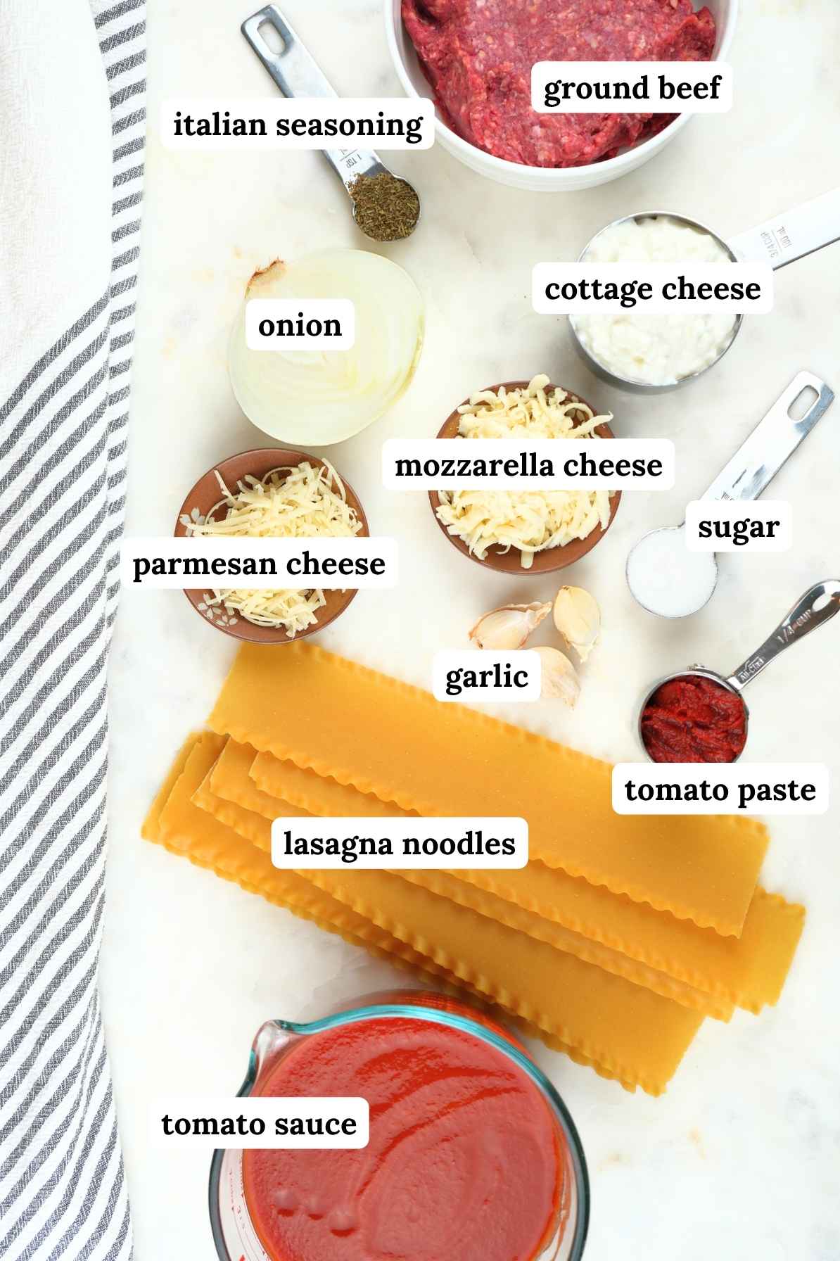 Slow cooker lasagna ingredients displayed and labeled