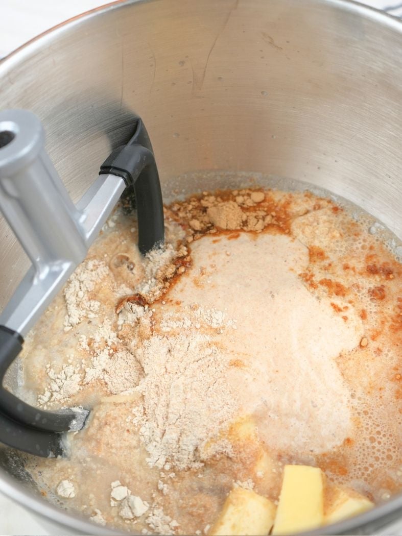 Pan de mie ingredients in a stand mixer bowl, shown with paddle attachment