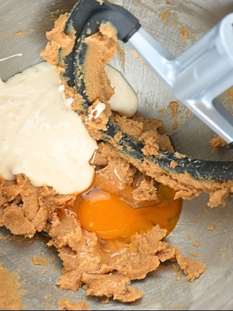 Sourdough starter, egg, and vanilla on the creamed butter and sugar