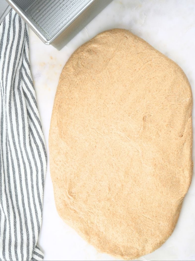 Dough stretched into a oval shape