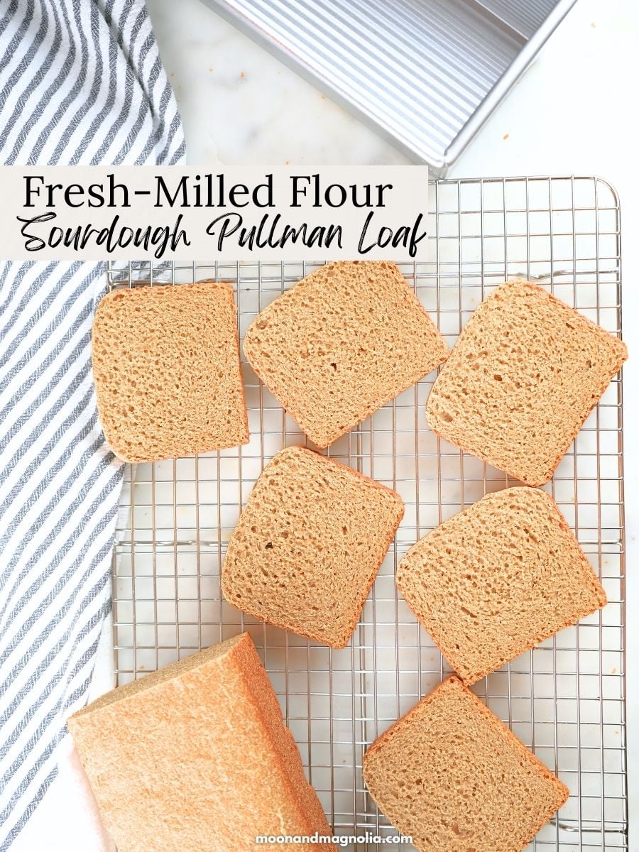 Slices of bread scattered on a cooling rack. Text overlay says, "Fresh-Milled Flour Sourdough Pullman Loaf"