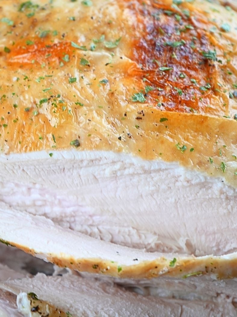Close up of sliced, cooked chicken bread