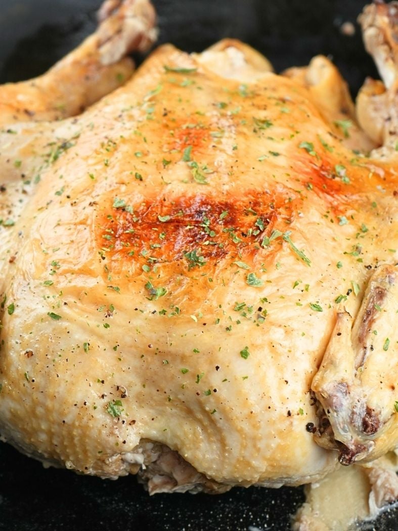 A frozen chicken that has been cooked in an Instant Pot and browed under the broiler