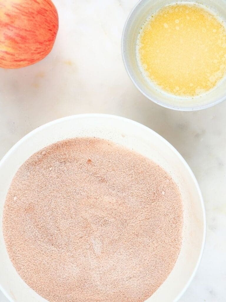 Bowls of cinnamon-sugar topping and butter