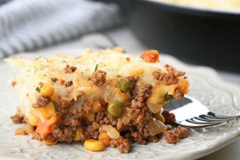 A scoop of shepherd's pie with corn, showing corn in the foreground